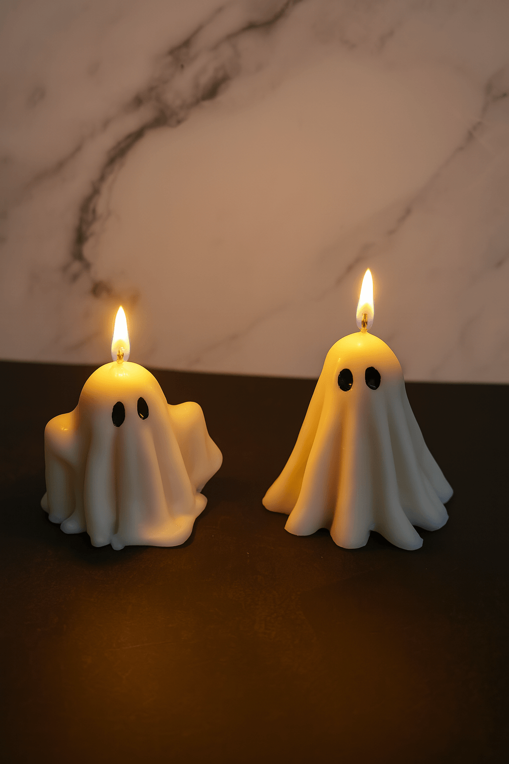 2 ghost candles lit