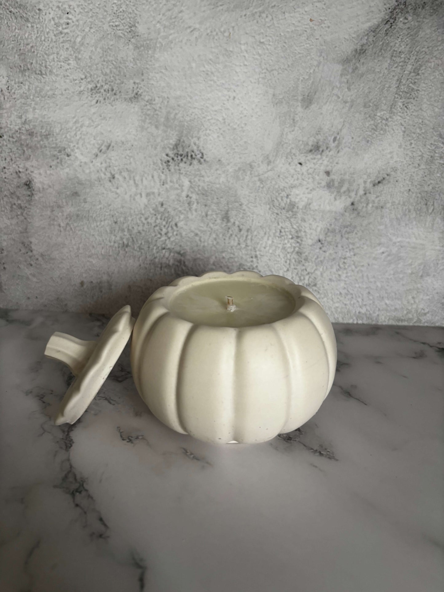 White pumpkin showing candle