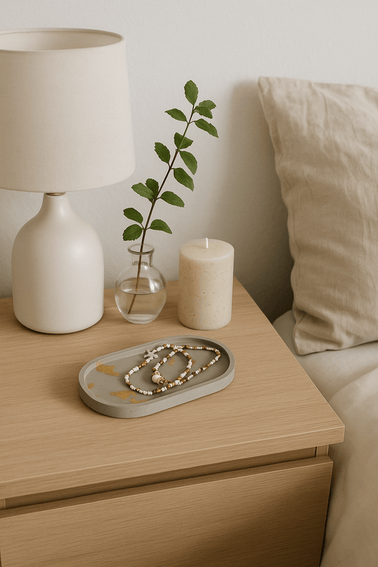 Grey oval tray on bedside table