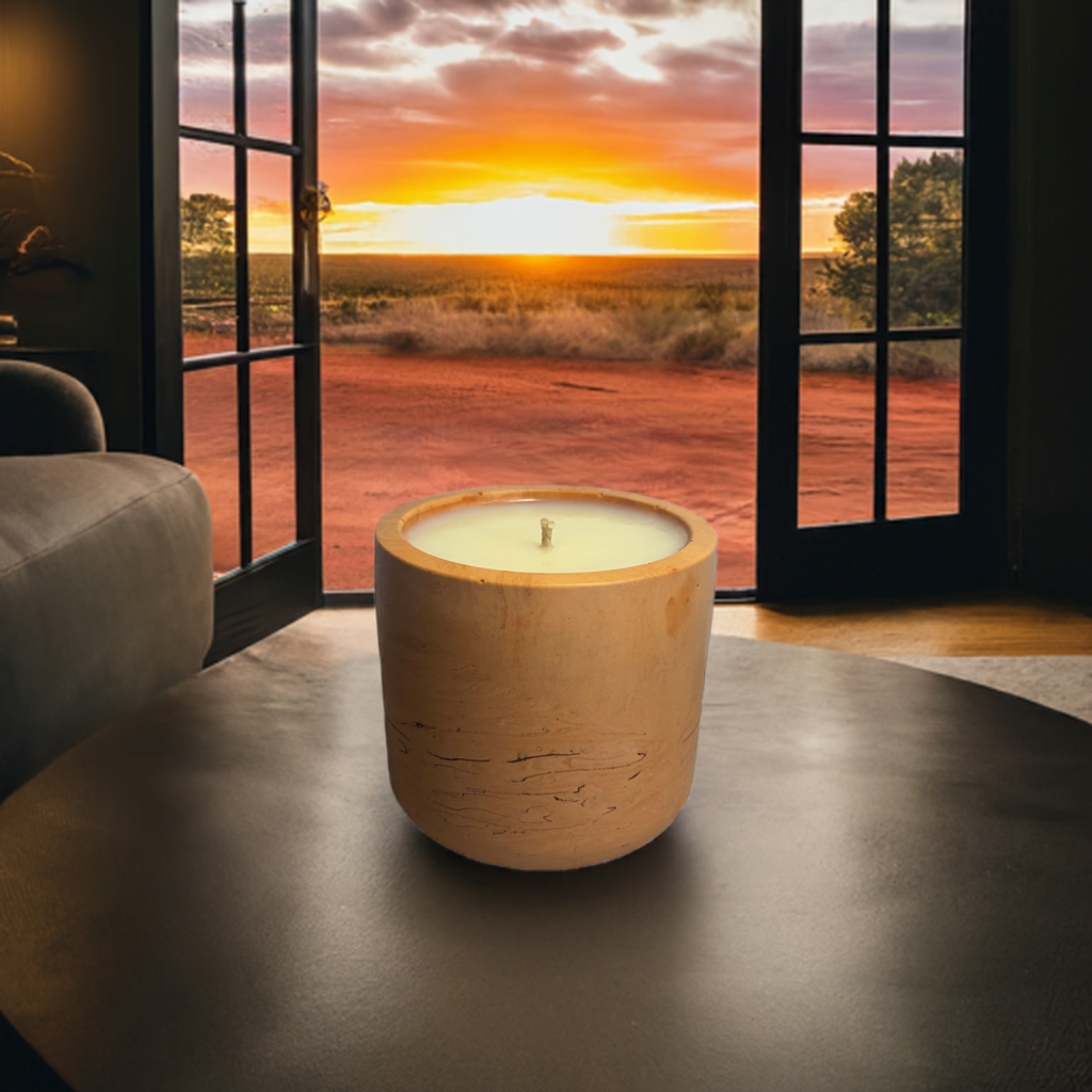 Candle with door open showing Australian outback