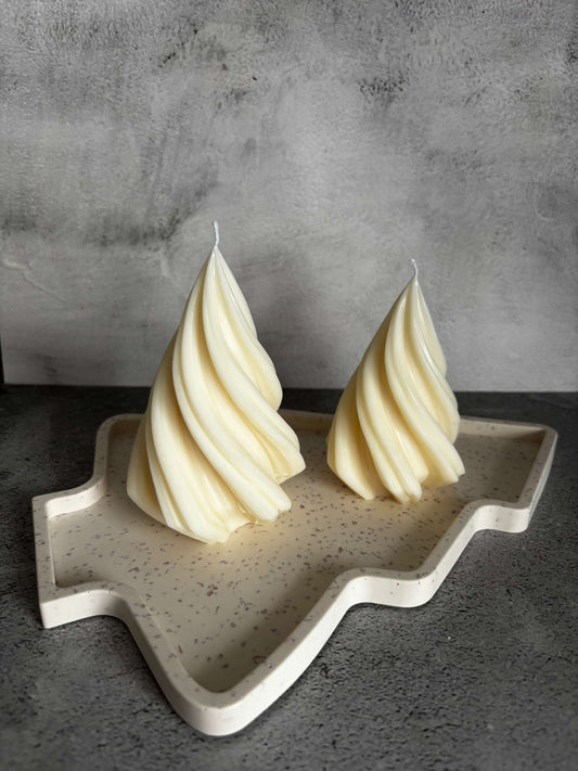 Butter mold with shaped butter on a gray surface