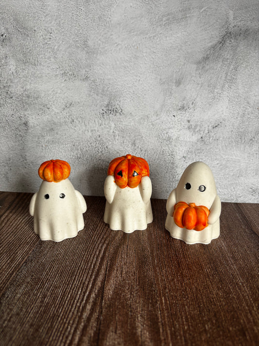 3 ghosts with orange pumpkins