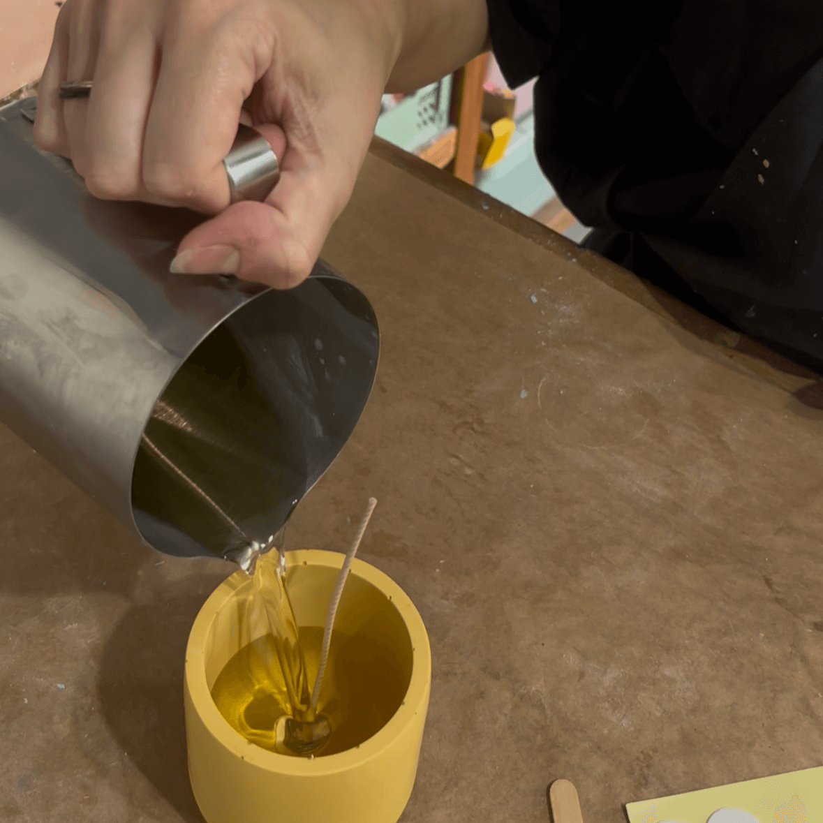 pouring wax into jesmonite pot 